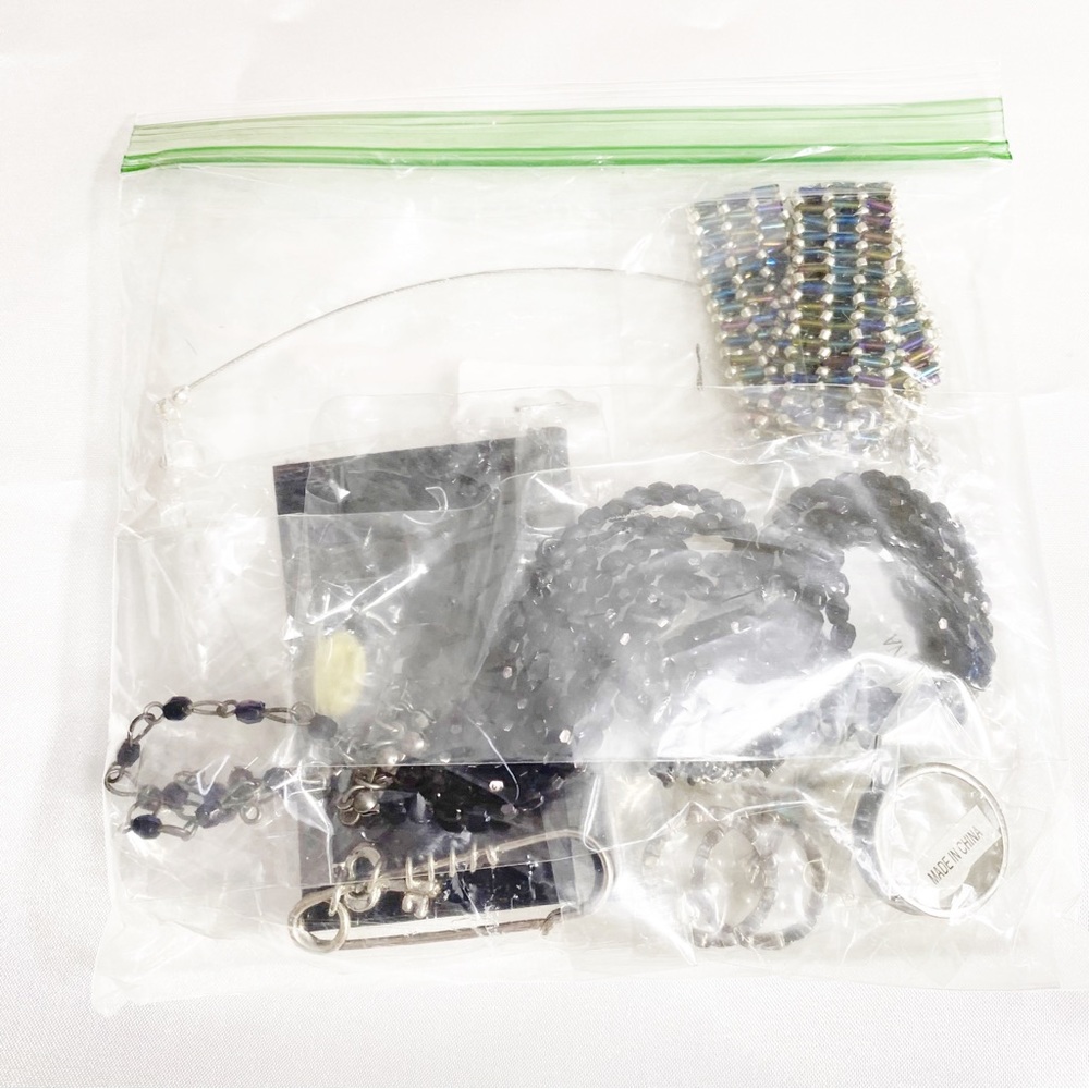 8 pc. grab bag costume jewelery. New in package.